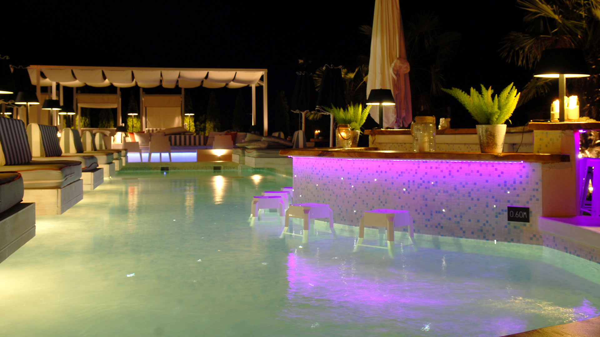 Pool bar at night with purple lights